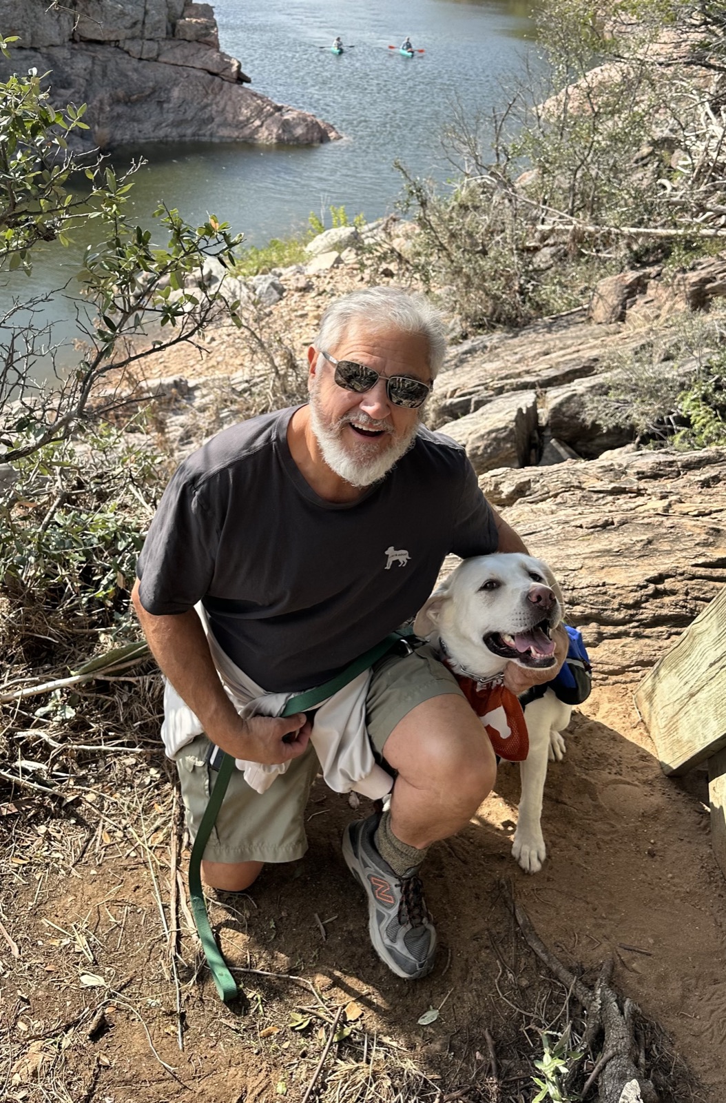 Charlie hiking with Haley, his white lab